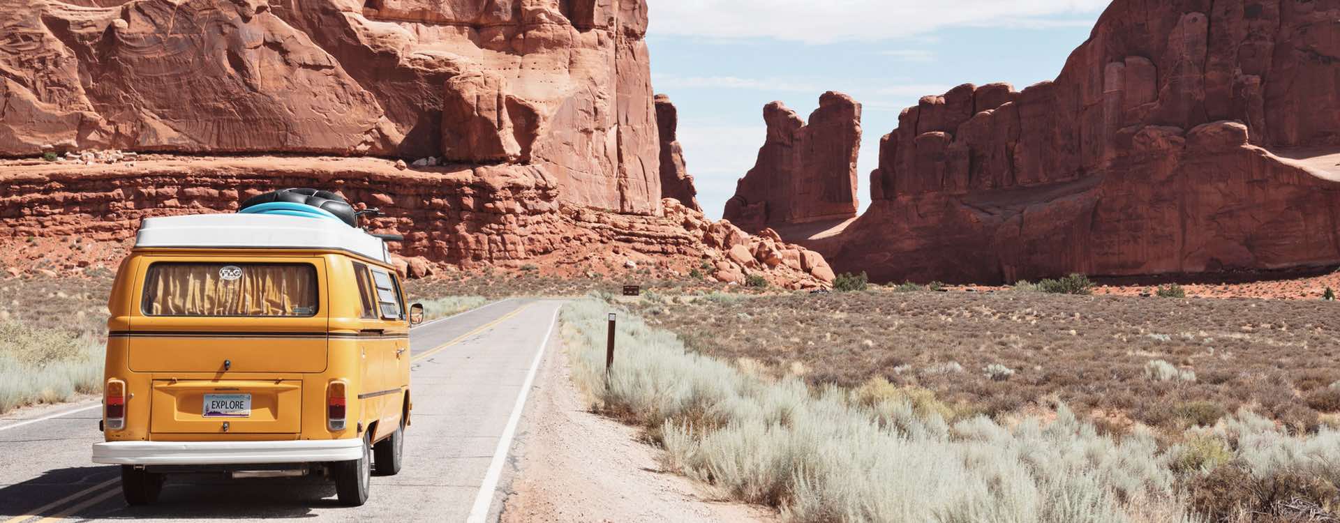 Explore yellow van on desert road
